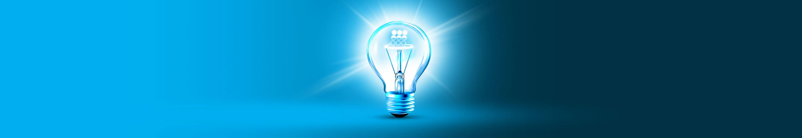 Glowing light bulb on gradient blue background