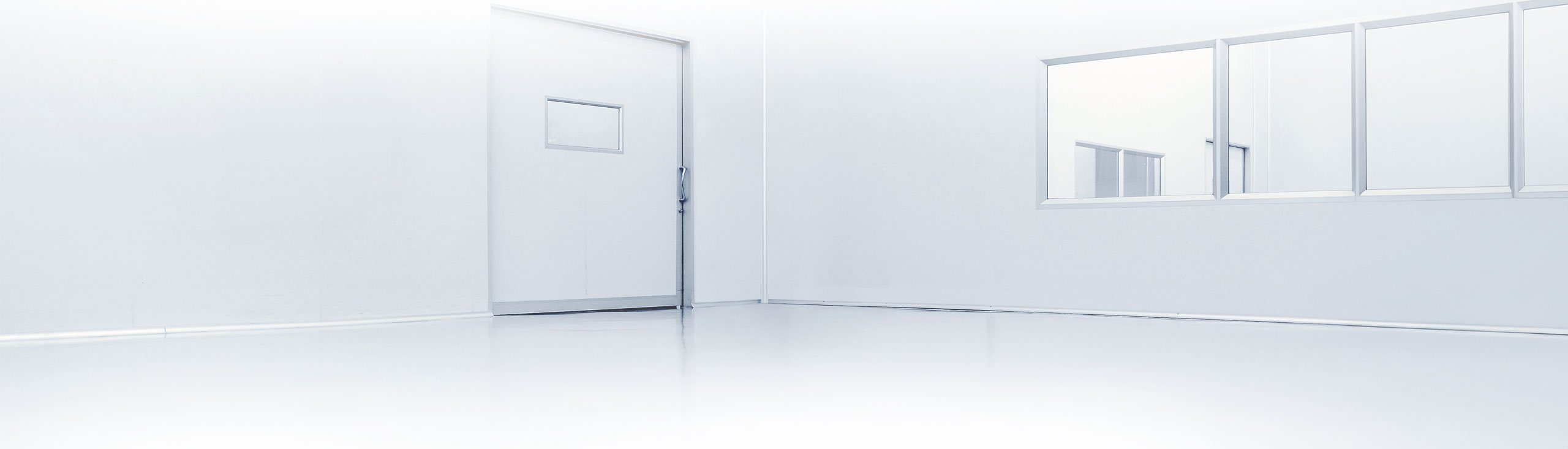 White cleanroom with door and windows.