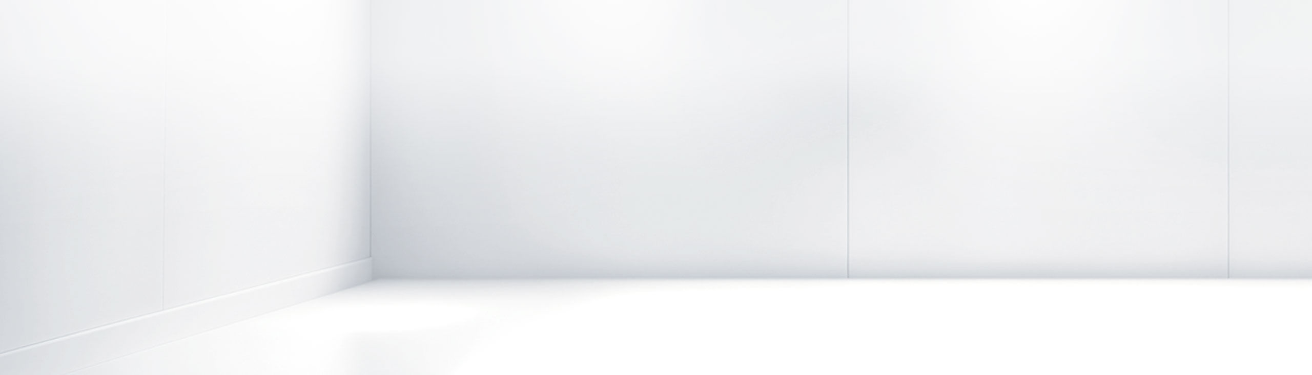 Minimalistic white room interior with clean walls.
