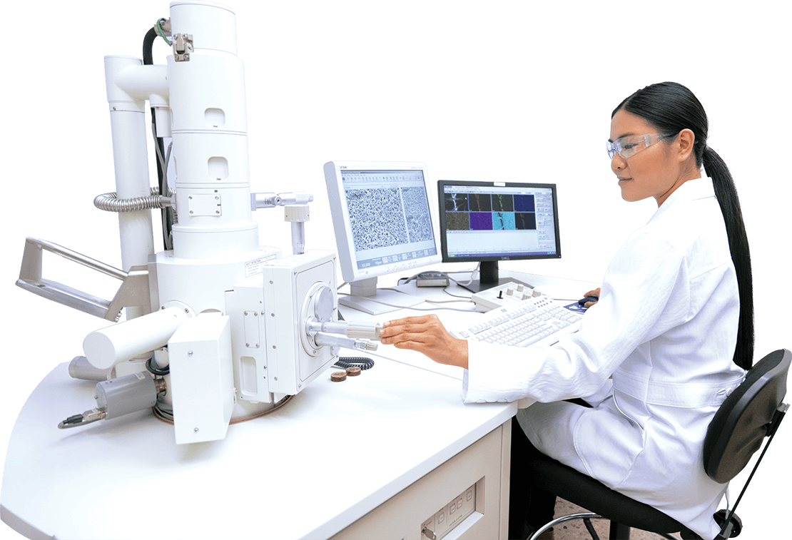 Scientist analyzing data on electron microscope.